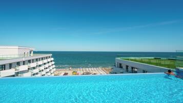 Seasonal outdoor pool, pool umbrellas, sun loungers