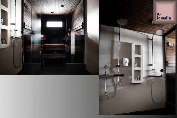 A modern bathroom with a wooden ceiling, a glass shower enclosure, and a white tiled wall with a built-in medicine cabinet.
