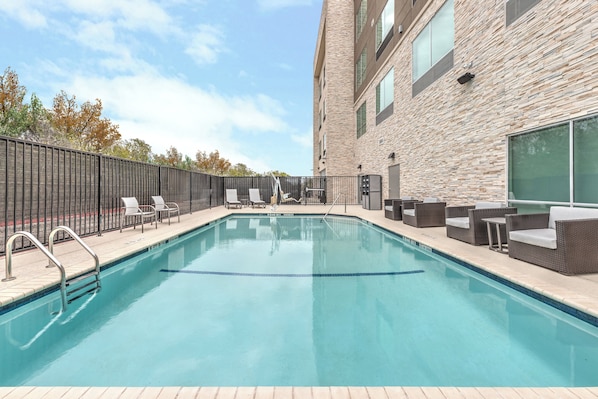 Seasonal outdoor pool, open 9:00 AM to 10:00 PM, pool umbrellas