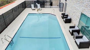 Seasonal outdoor pool, open 9:00 AM to 10:00 PM, pool umbrellas