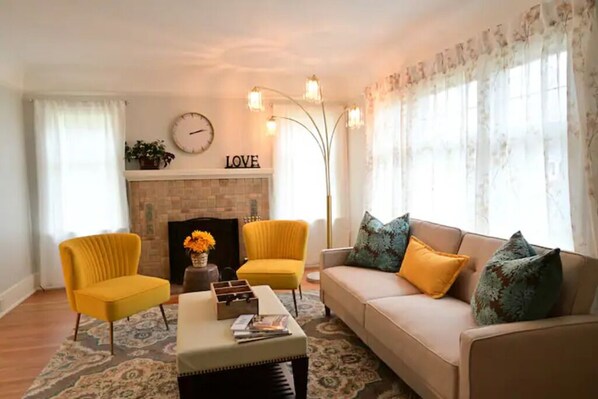 Living room with decorative fireplace. 
