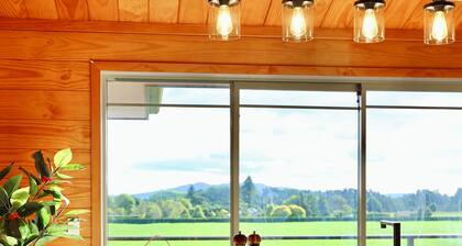 The Farmette on top of the hill, with great views, and friendly animals