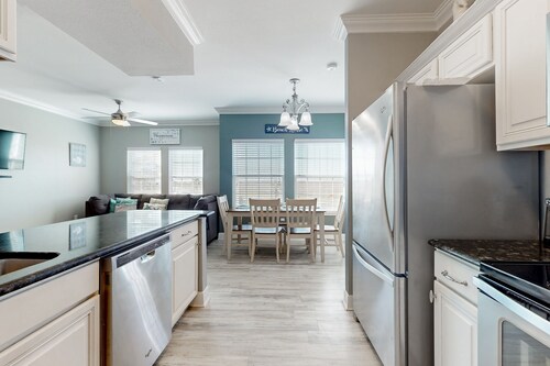 Ocean view condo with direct beach access, pool, grill, smart TVs, AC, & W/D