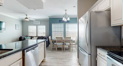 Ocean view condo with direct beach access, pool, grill, smart TVs, AC, & W/D