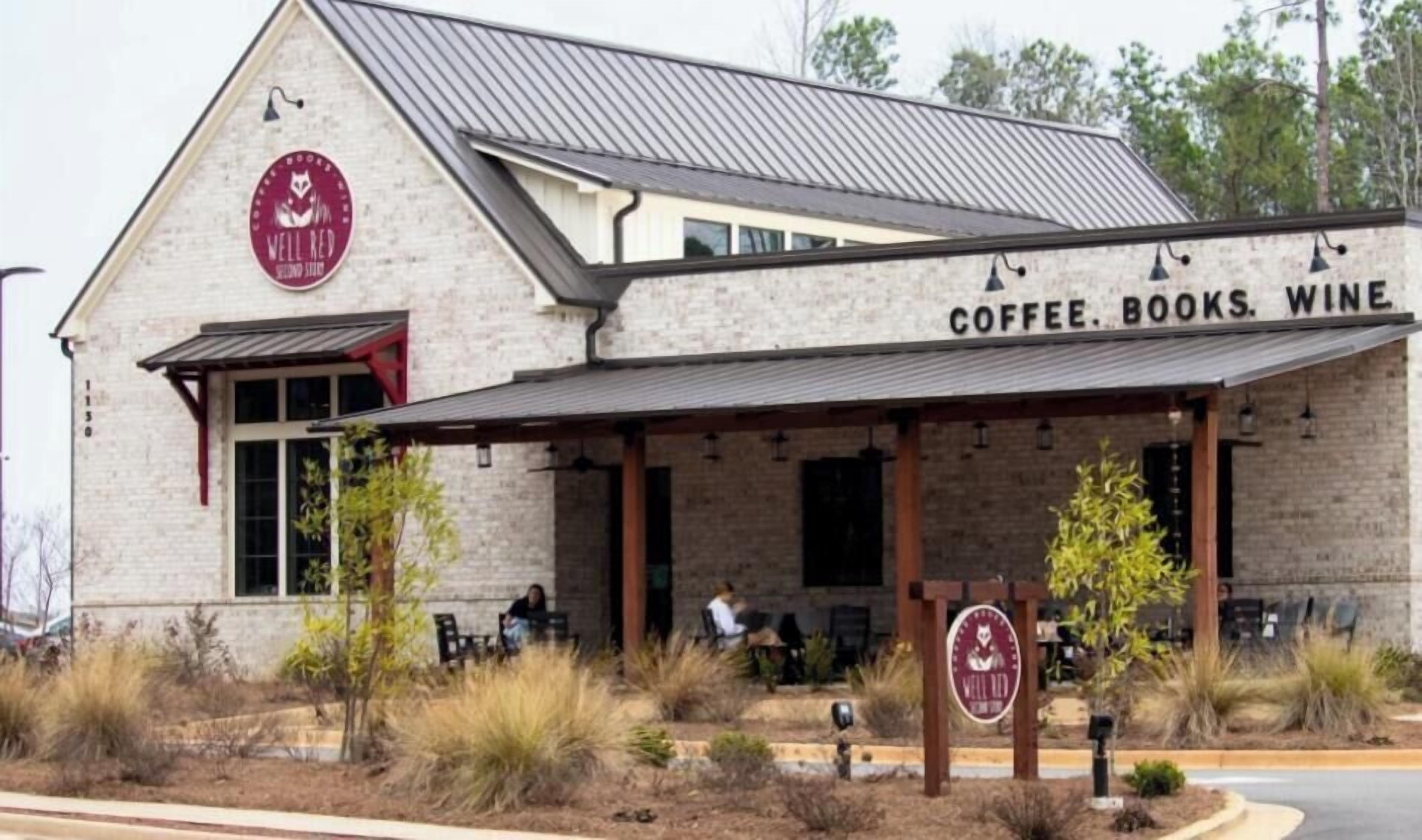 A building with a sign that reads 'COFFEE. BOOKS. WINE.'