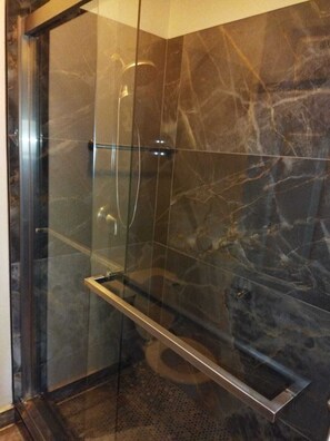 Shower, hair dryer, towels, toilet paper