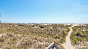 A coastal path with dunes and sparse vegetation. - 3C Mariners Walk by Avantstay Beach & Pool Access, Enclosed Porch (Isle of Palms)