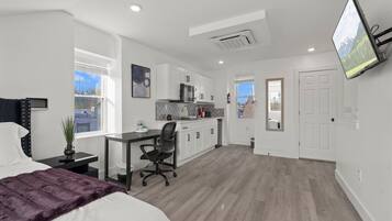 Superior Suite, Non Smoking | Living area | 42-inch Smart TV with digital channels