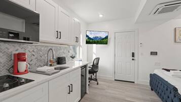 Standard Suite, Non Smoking | Living area | 42-inch Smart TV with digital channels