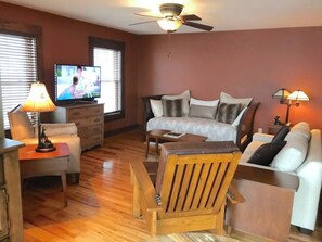 Smart TV, fireplace, books, offices