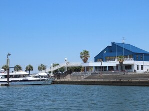 Enjoy waterfront views from the balcony of this property, with a restaurant nearby and a dock for boat access.