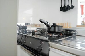 Fridge, microwave, stovetop, cookware/dishes/utensils