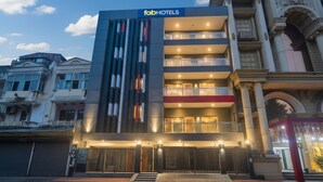 A modern hotel with a prominent facade, multiple balconies, and a gated entrance. - Fabhotel The Luxe Inn (New Delhi)
