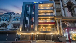 A modern hotel with a prominent facade, multiple balconies, and a gated entrance. - Fabhotel The Luxe Inn (New Delhi)
