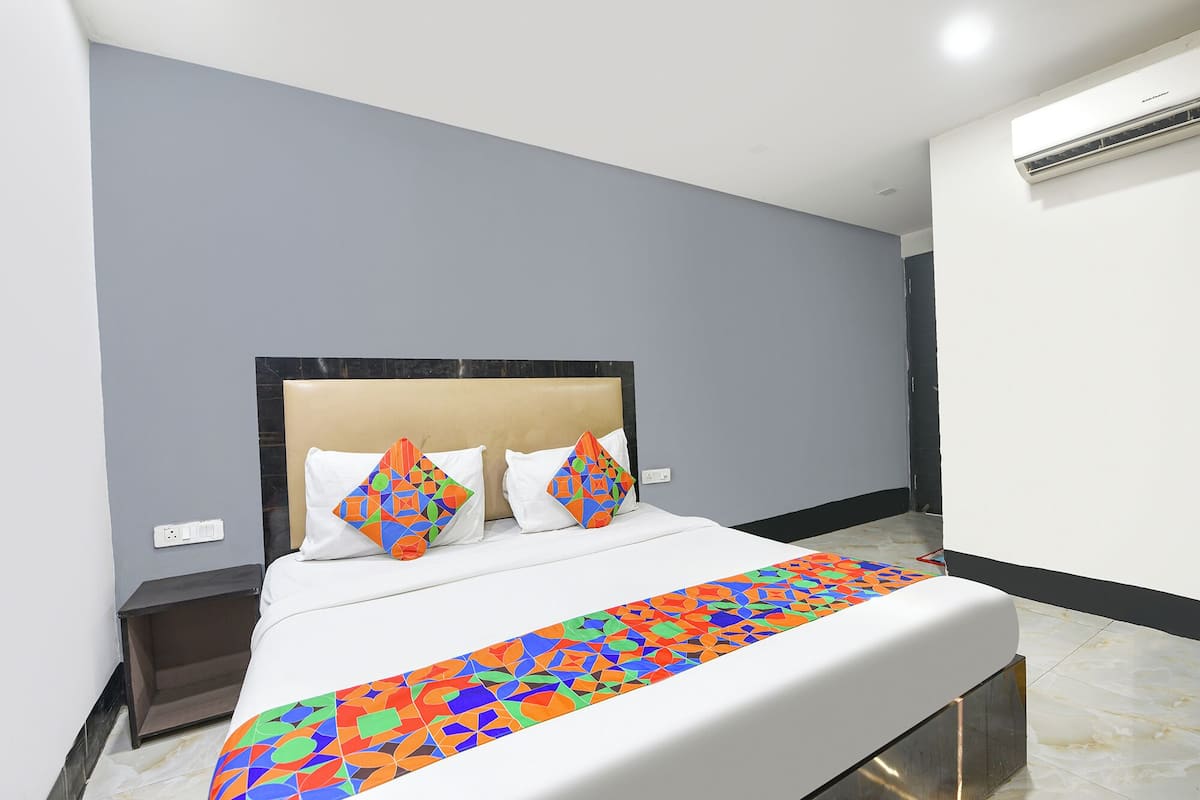 Chambre Deluxe | Draps en coton égyptien, literie de qualité, coffre-fort