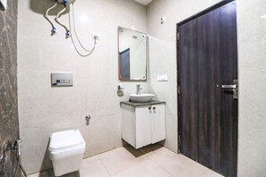 Habitación Deluxe | Baño | Ducha y cabezal de ducha tipo lluvia