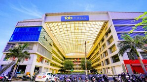 A hotel with a modern design, featuring a prominent 'fabHOTELS' sign, a covered atrium, and multiple floors. - Fabhotel Royal Paradise (Surat)