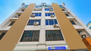 A multi-story building with a sign for 'fab hotels' indicating a hotel presence. - Fabhotel Royal Ville (Patna)
