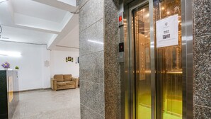 An elevator with a sign indicating it's not allowed. - Fabhotel 24&7 (New Delhi)