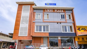 A multi-story building named Likh Plaza with a modern facade, featuring a mix of brick and metal panels. - Fabexpress Dau Ji Residency (Mathura)