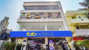 A multi-story building with a prominent 'fab hotels' sign at the ground level. - Fabhotel Easy Nest (Bengaluru)