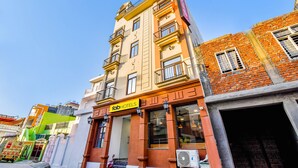 A multi-story building with a prominent 'fab hotels' sign, featuring balconies and large windows. - Fabexpress Ganges Pride (Haridwar)