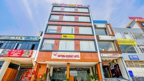 A multi-story building with a sign for Victoria Regency Hotel. - Fabhotel Prime Victoria Regency (Mohali)