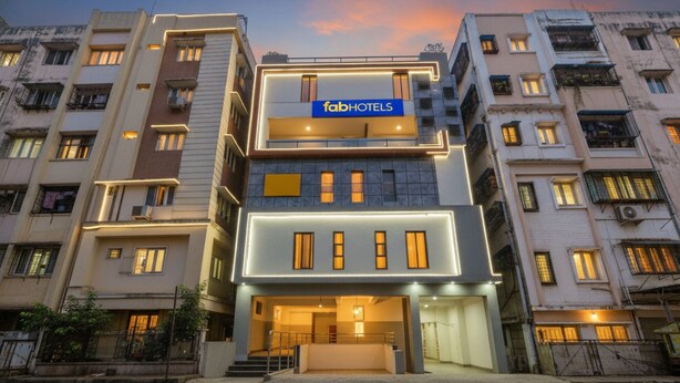 A modern hotel building with a prominent 'fabHOTELS' sign. It features multiple floors with balconies and a central entrance. - FabHotel Starhood - Manikonda (Hyderabad)