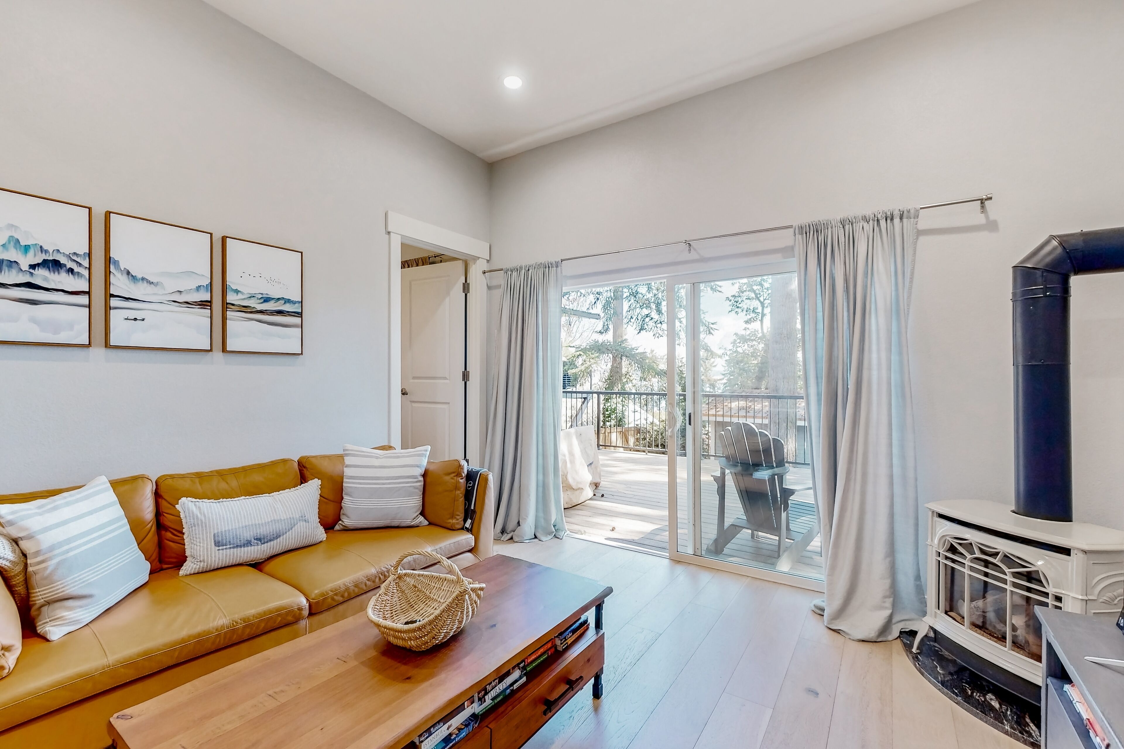 Light-filled home with Puget Sound view, great deck, fenced yard & fireplace