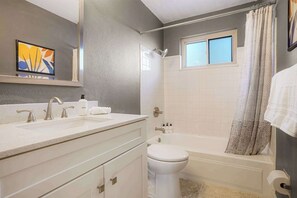 Shower, hair dryer, towels, shampoo