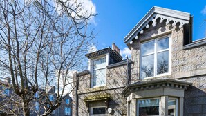 A stone building with a bay window, a front door, and a small porch. - Fountainhall Townhouse Aberdeen City (Aberdeen)