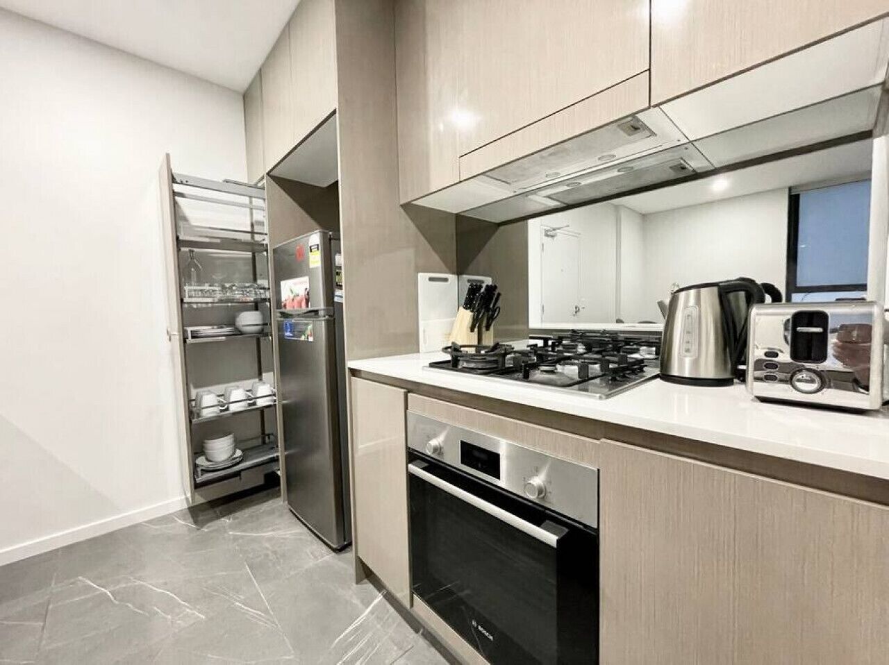 Fridge, coffee/tea maker, cookware/dishes/utensils