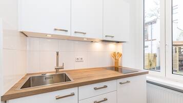 Fridge, microwave, stovetop, coffee/tea maker