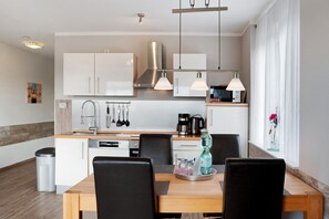 Fridge, stovetop, coffee/tea maker, electric kettle