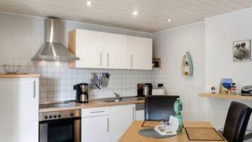 Fridge, stovetop, coffee/tea maker, electric kettle