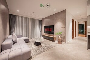 Premium Apartment, 3 Bedrooms, Balcony, Corner | Living area | 55-inch flat-screen TV with cable channels, Netflix, streaming services