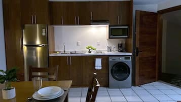 Deluxe Studio Suite, 1 Queen Bed | Private kitchen | Full-size fridge, microwave, stovetop, coffee/tea maker