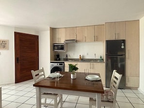 Deluxe Loft, Kitchen | Private kitchen | Full-size fridge, microwave, stovetop, coffee/tea maker