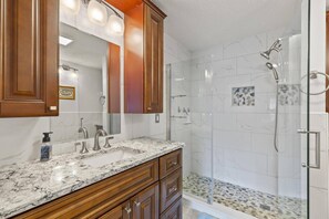 Shower, hair dryer, towels, shampoo