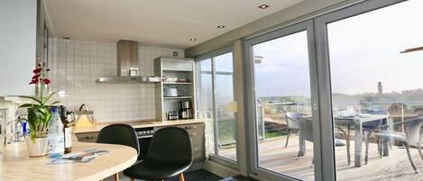 Fridge, stovetop, dishwasher, coffee/tea maker