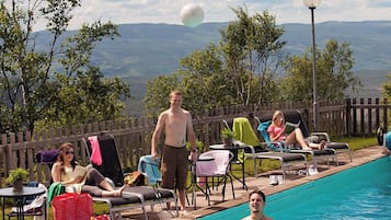Seasonal outdoor pool, pool loungers