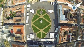 An aerial view of a city square with a central lawn and surrounding buildings. - Apartment in Historic Building - Sleeps 4 (Timisoara)