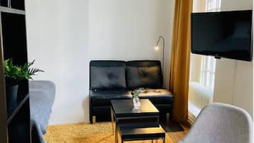 Standard Apartment | Living area | 32-inch TV with cable channels