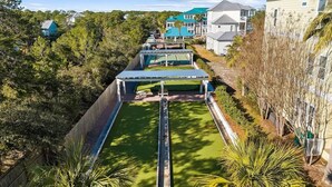 A residential area with houses, a swimming pool, and a covered patio area.