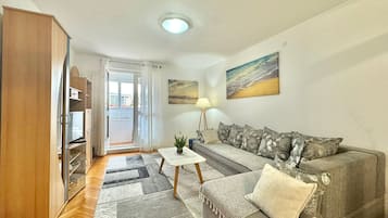 Comfort Apartment, Park View | Living area | 32-inch LCD TV with cable channels