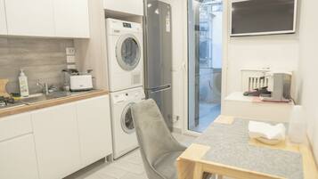 Comfort Apartment, No Windows | Private kitchen | Full-sized fridge, microwave, oven, stovetop