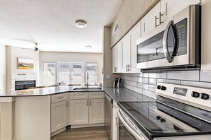 Fridge, dining tables - Landing | Incredible 2BD, Gym, Pool (Fort Worth)