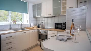 Family Villa | Private kitchen | Fridge, microwave, oven, espresso maker