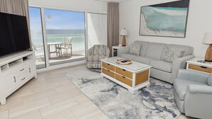 A modern living room with a television, sofa, and a view of the ocean through large sliding doors. - BH 402D Beautiful Views from this 2 bed/2 bath (Miramar Beach)