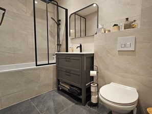 Shower, hair dryer, towels, toilet paper